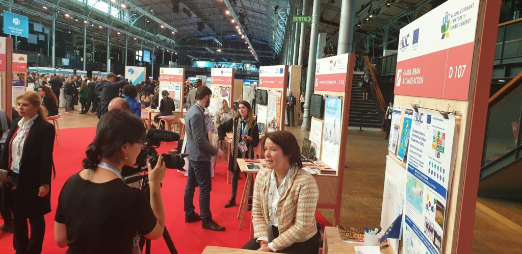 FPI Head of Unit Nona Deprez during an interview with Radio France at EU's IUC Asia stand